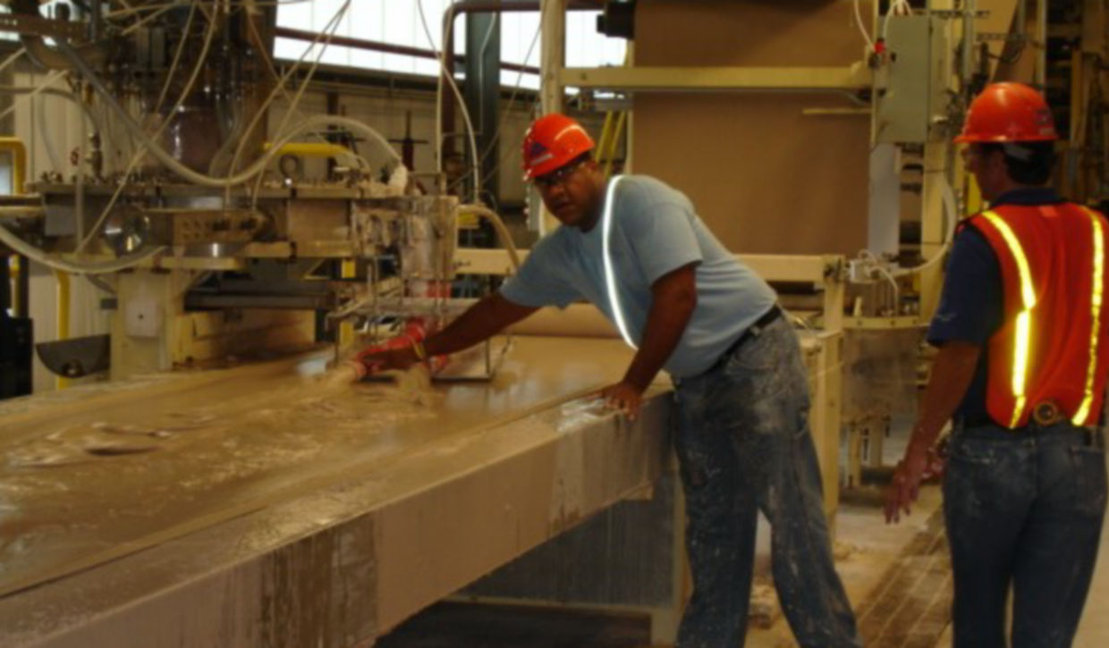 David Neal working in a gypsum plant early in his career.